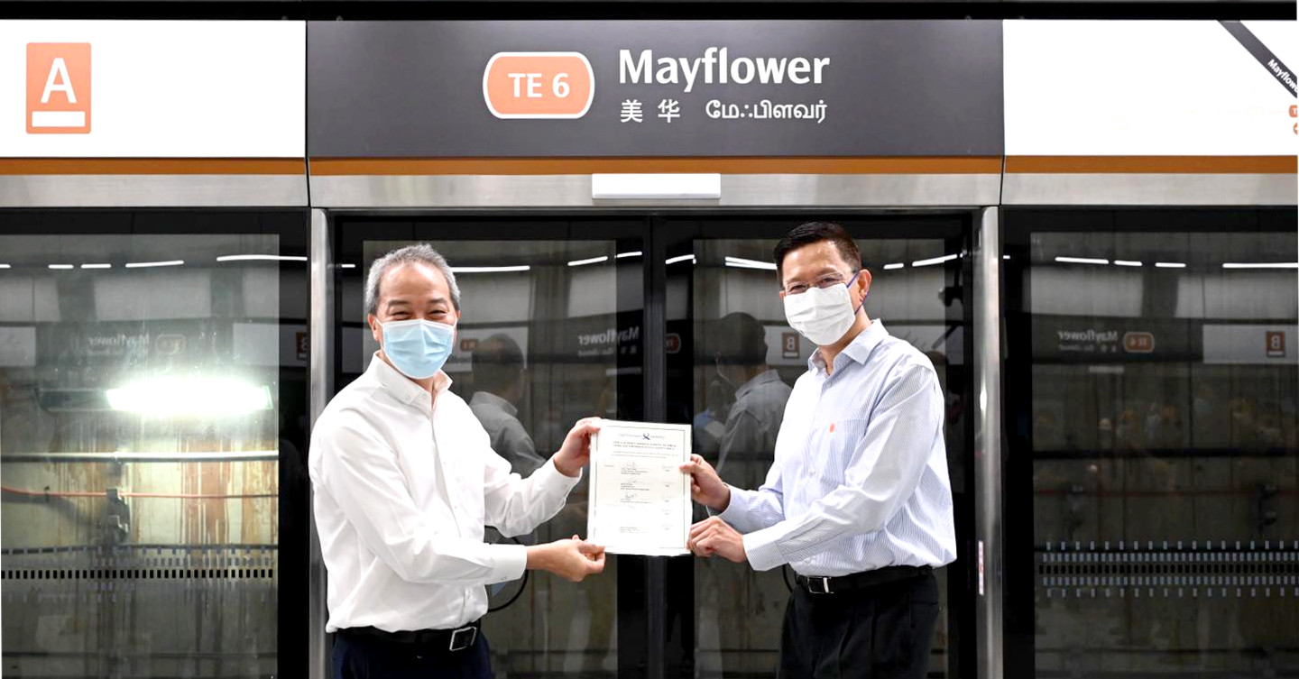 LTA CEO Ng Lang (left) handing over Thomson-East Coast Line Stage 2 (TEL2) to SMRT Group CEO Neo Kian Hong (right) at Mayflower MRT station