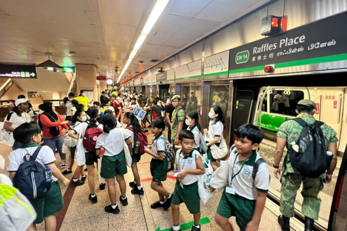 Primary 5 Students at Raffles Place MRT station for the NDP National Education Show. (Image: SMRT Service Excellence/LinkedIn)